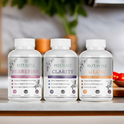 Three Botavive supplement bottles labeled 'Berberine', 'Clarity', and 'Glow' on a surface with a blurred background.